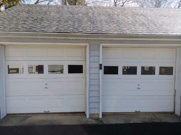 Before a completed garage door contractor project in the  area